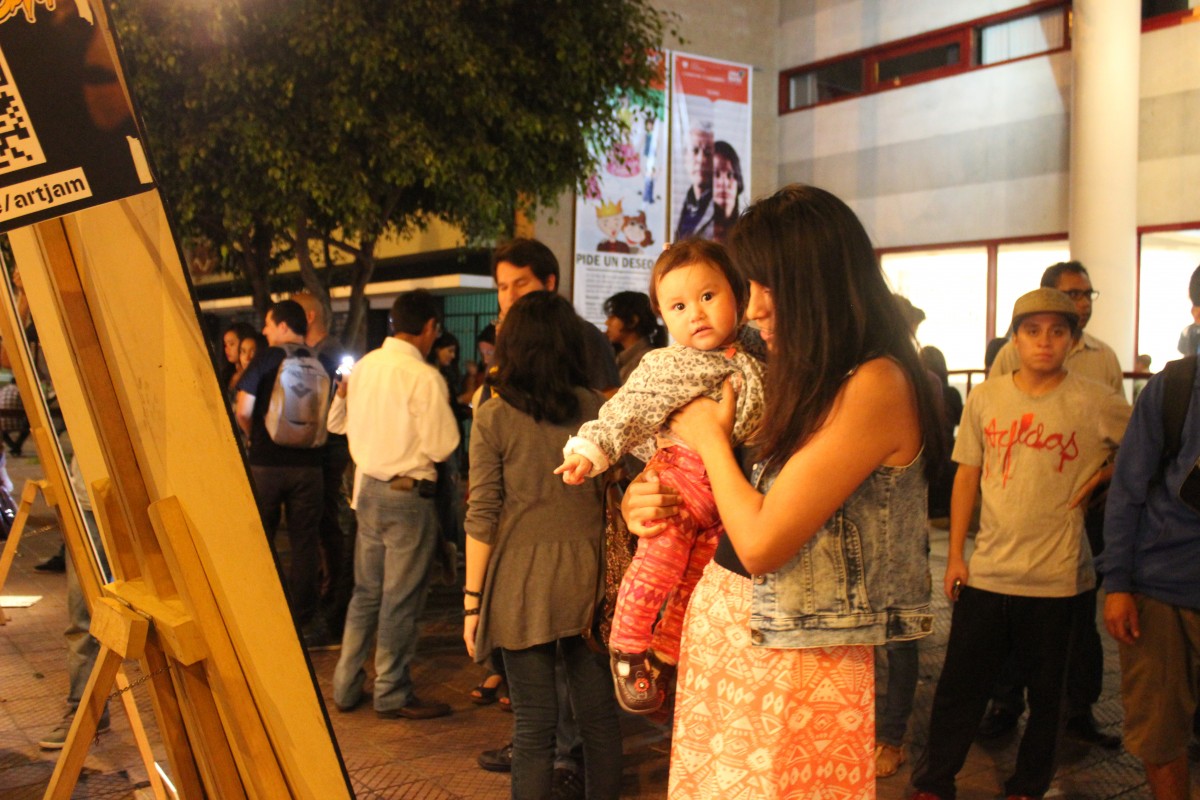 A little fan admires the finished artwork
